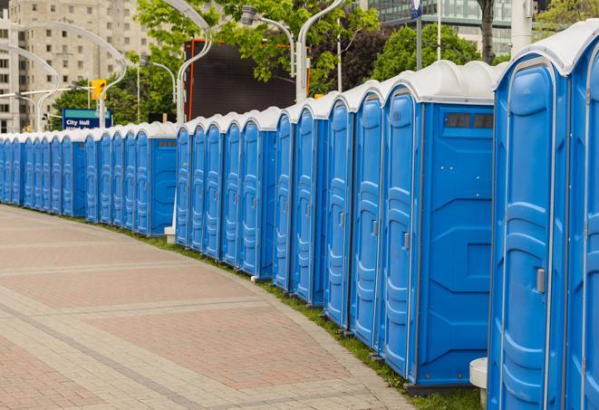 a line of portable restrooms at a sporting event, providing athletes and spectators with clean and accessible facilities in Aurora IL